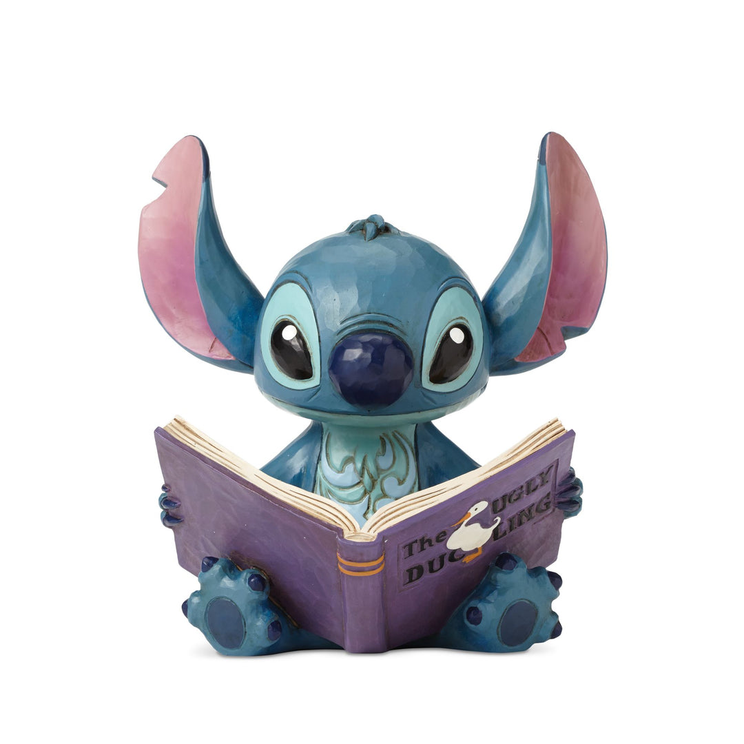 Jim Shore Stitch Finding a Family storybook figurine front view