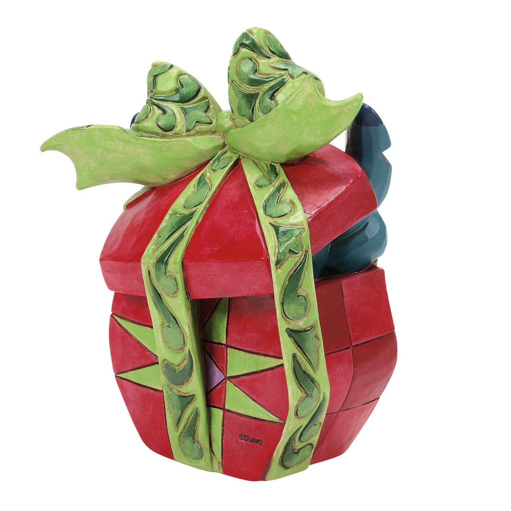 Jim Shore Stitch Tearing Present collectable in packaging view