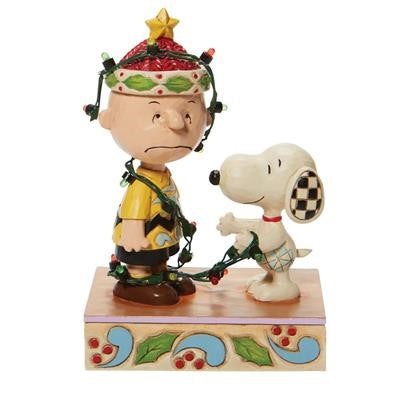 Jim Shore Peanuts Charlie Brown & Snoopy Tangled in Lights Light-Up Figurine. Original supplier product photograph.
