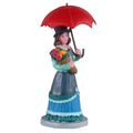 Lemax Lovely Lady figurine holding flowers beneath a red parasol