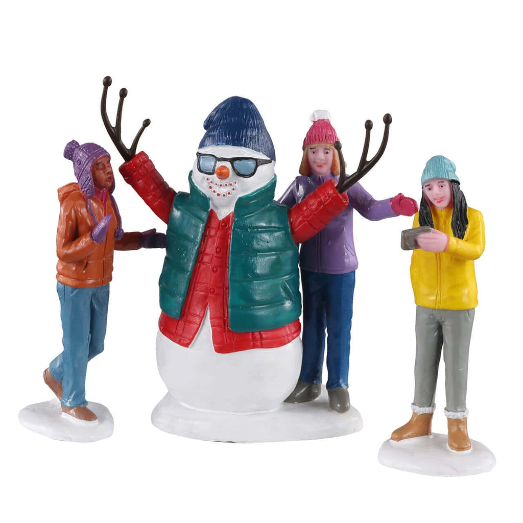 Lemax Snowman Selfie figurine set with four friends posing around a snowman
